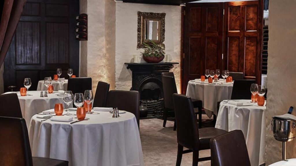 Dax Restaurant Dublin interior with white tablecloths, elegant place settings, and intimate cellar-style dining, perfect for Christmas lunch in Dublin