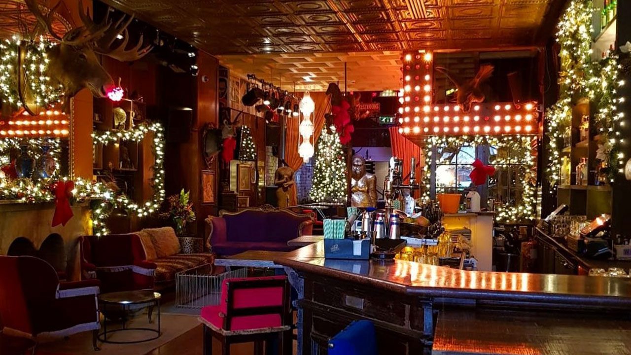 Festive Room at 37 Dawson Street for Christmas Party Nights Colourful festive room at 37 Dawson Street with bright lights and Christmas tree for Christmas party nights