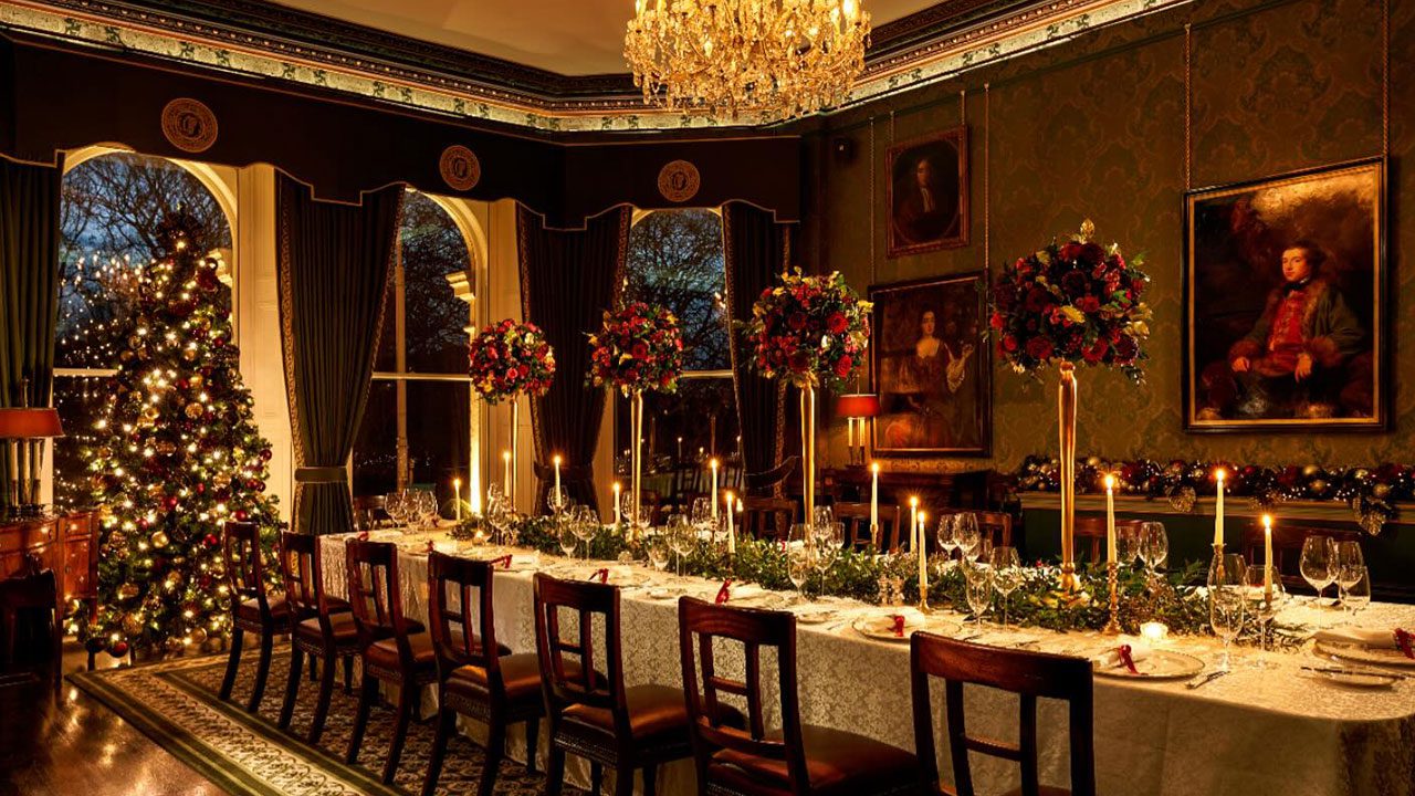 Elegant Setup for Christmas Party Nights at The Shelbourne Long dinner table set for Christmas party nights with candles and festive décor at The Shelbourne Hotel