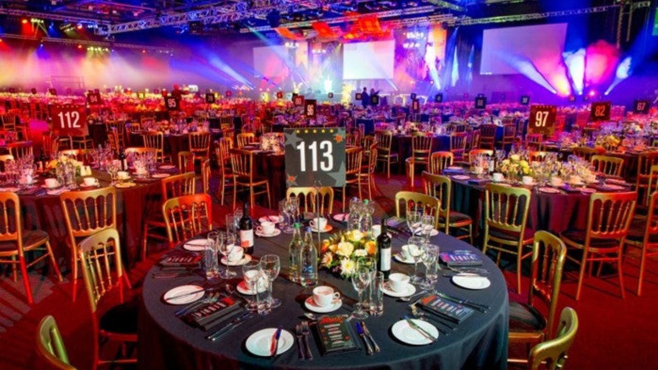 Corporate event venues in Dublin – gala dinner setup with stage and lighting