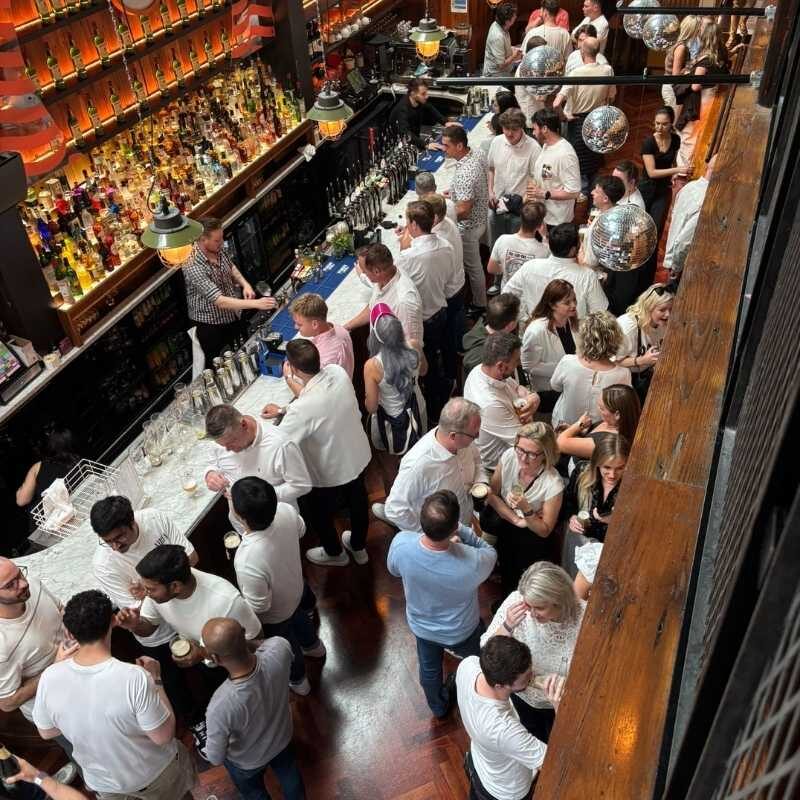 Guests enjoying Citco's corporate summer party at Nolita in Dublin, with colleagues socialising throughout the venue during a successful company celebration.