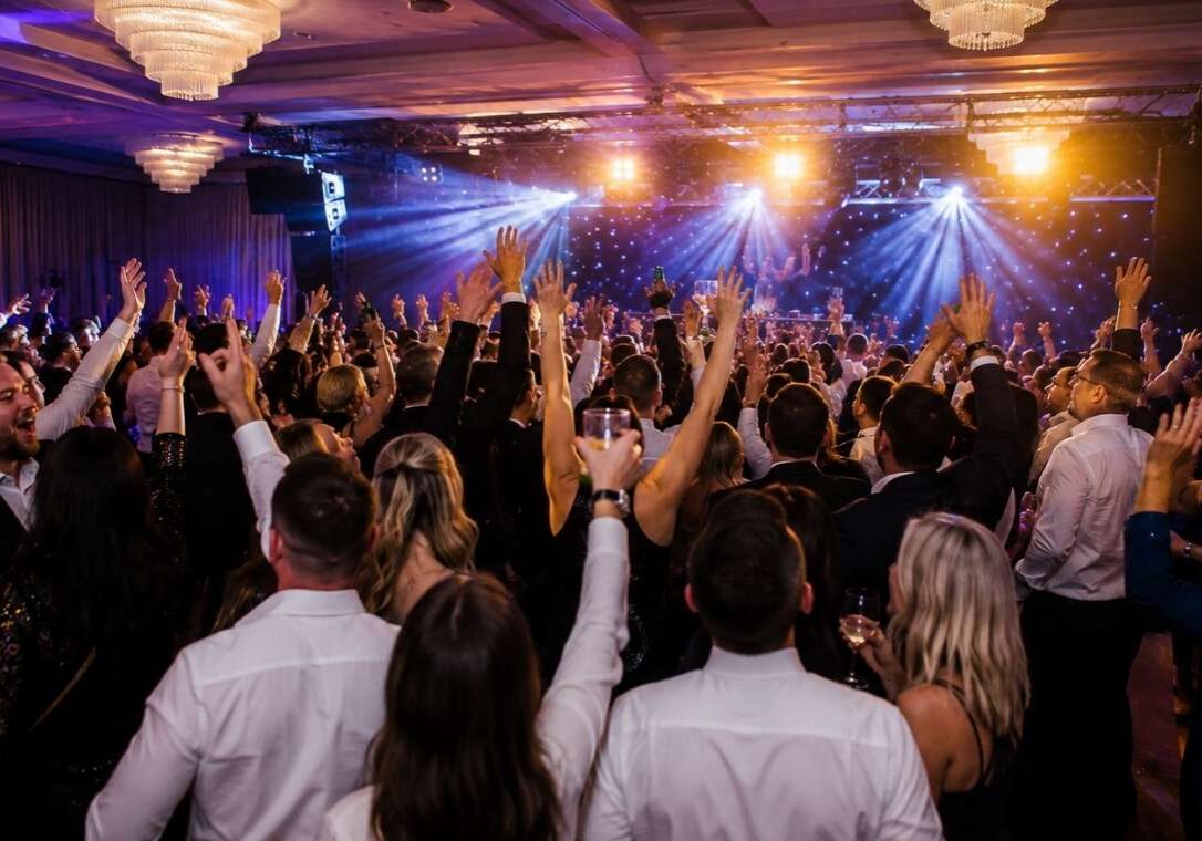 Guests enjoying the evening entertainment and lively atmosphere during a corporate summer party at a premier Dublin venue.