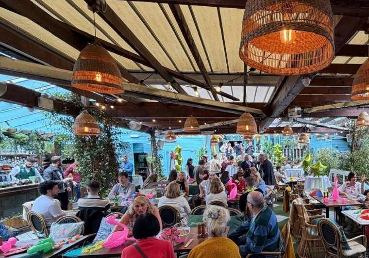 Guests enjoying the outdoor terrace at a corporate summer party ih House Dublin on a sunny June evening in Dublin.